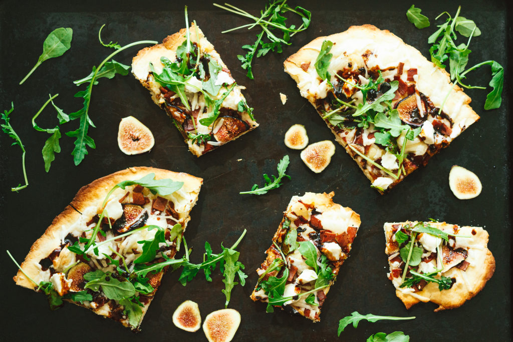 vegan fig and bacon pizza with arugula